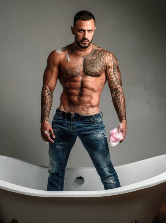 Photo for Muscular athletic sexy male with naked torso. Man with tattooed body. Confident and handsome Brutal man. Mens health. Beautiful male torso - Royalty Free Image