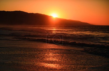 Photo for Sunrise in the sea with soft wave and cloudy. Beach sunrise over the tropical sea. Colorful sunset with wave splashes on the beach - Royalty Free Image