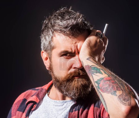 Photo for Beard man with cigarette. Beard care concept. The bristle irritated his skin. Shampoo and conditioner for a bearded man. Male beauty care, facial hair care. Bearded man smoke cigarette - Royalty Free Image