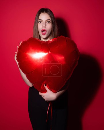 Photo for Valentines day, love heart. Portrait of lovely valentine girl hold red heart. Beautiful woman celebrate valentines day. Woman in love. Woman on valentines party. Symbol of love. Valentine card - Royalty Free Image