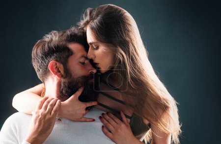 Photo for Sensual girl moaning with desire caressing boyfriend during foreplay or making love. Sensual couple enjoying intimacy. Intimate relationship and sexual relations - Royalty Free Image
