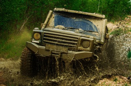 Off-road travel on mountain road. Track on mud. Best Off Road Vehicles. 4x4 Off-road suv car. Offroad car. Safari suv. Safari. Mudding is off-roading through an area of wet mud or clay