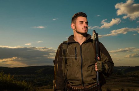 Photo for Young hunter. American hunting rifles. Hunting without borders. Hunter with shotgun gun on hunt. Portrait of handsome Hunter - Royalty Free Image