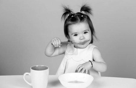 Babies eating, healthy food for a baby. Little baby eating fruit puree