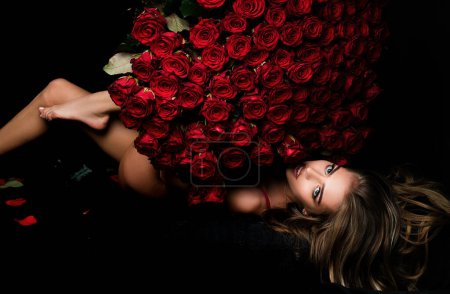 Photo for Happy girl hugs a bouquet. Gift on Valentines day. Fashion studio portrait of beautiful woman. Gift on Valentines day. Valentine - Royalty Free Image
