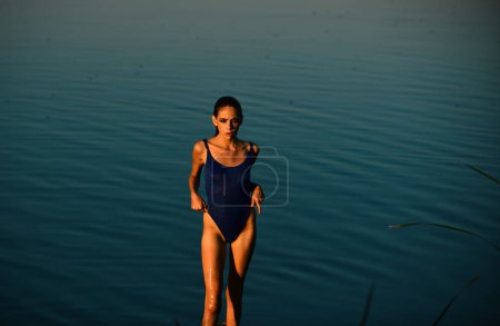 Photo for Female swimsuit fashion. Slim girl in swim-suit. Sporty bikini. Sexy girl with sexy body. Summer leisure - Royalty Free Image