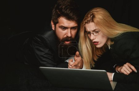 Photo for Two business partners working with laptop together. Couple guy and girl surfing internet in laptop. Portrait of business people - Royalty Free Image