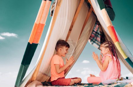 Photo for Happy children. Brother and sister relationships. Affection and care. Children family playing in tent. Cute kids having fun outdoors - Royalty Free Image