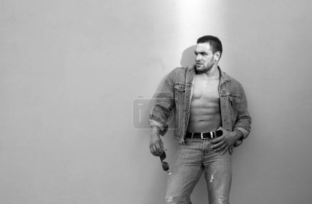 Photo for Jeanse fashion. Handsome man bare torso. Naked male body. Sexy muscular man. Nude abs - Royalty Free Image