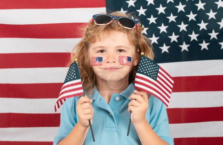 Photo for Child celebration independence day 4th of july. United States of America concept. Sign of american flag on child cheek. USA flag concept - Royalty Free Image