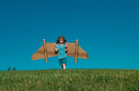 Photo for Happy child playing with toy jetpack. Kid pilot having fun outdoor. Success child, innovation and leader. Creative and start up concept. Imagination child having startup idea - Royalty Free Image