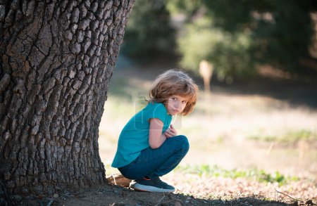 Photo for Lonely child outdoor. Children adaptation. Kids depression, problems. Loneliness child. Negative emotions nervous breakdown - Royalty Free Image