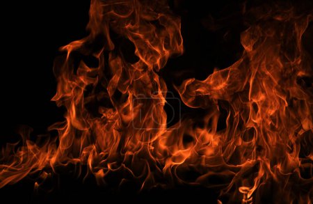 Foto de Textura de fuego sobre fondo negro. Fondo de llama de fuego abstracto, gran fuego ardiente - Imagen libre de derechos