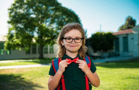Photo for Schoolboy ready to study. Education and learning for kids. Portrait of elementary pupil in school park - Royalty Free Image