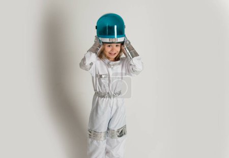 Photo for Child boy is dressed in an astronaut costume. Isolated background with copy space - Royalty Free Image