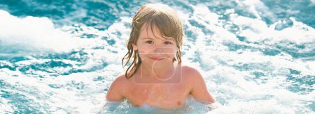 Cute boy swim in pool. Active healthy kids lifestyle, water sport activity and lessons for summer family vacation with child. Banner for header, copy space. Poster for web design