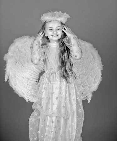 Foto de Angel child girl with wings, valentines day. Little prince greeting card - Imagen libre de derechos