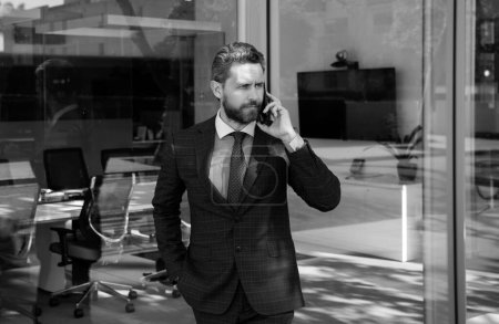 Photo for Business man using smartphone. Businessman talking on phone - Royalty Free Image
