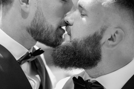 Gay kiss on wedding. Marriage gay couple tender kissing. Close up portrait of gay kissed. Portrait of happy gay couple on their wedding day outdoor