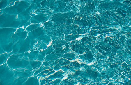 Water in swimming pool, background with high resolution. Wave abstract or rippled water texture