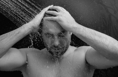Photo for Man taking morning shower. Washing hair under water falling from shower head. Close up guy showering. Body care hygiene. Shower concept. Man is under water drops in shower. Wellness and spa - Royalty Free Image
