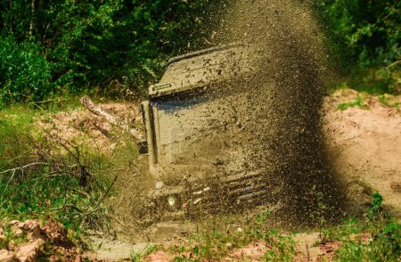 Photo for Adventure travel. Motion the wheels tires and off-road that goes in the dust. Rally racing - Royalty Free Image