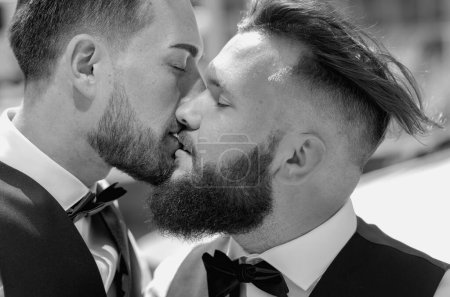 Gay kiss on wedding. Marriage gay couple tender kissing. Close up portrait of gay kissed. Portrait of gay couple in love on wedding day