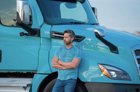 Photo for Men driver near lorry truck. Truck driver in safety vest near truck. Trucker man. Transportation vehicles. Handsome man driver front of truck. Semi trailer semi trucks - Royalty Free Image