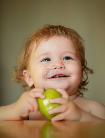 Portrait of cute Caucasian child kid with apple. Kid with fresh fruit