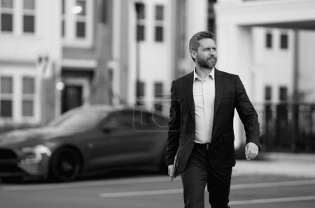 Photo for Businessman leaving office. Businessman walking home from work. Businessman working late. Businessman after success office work. End of business day. Successful business man in business suit outdoor - Royalty Free Image