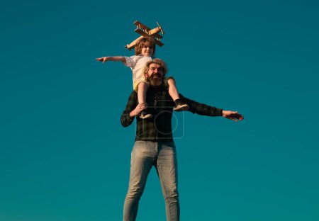 Photo for Success and child leader concept. Child and dad playing. Kid pilot aviator and daddy dreams of traveling - Royalty Free Image
