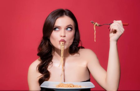 Italian woman eats Bolognese pasta. Woman cooked spaghetti. Italia food and menu concept. Woman suck spaghetti