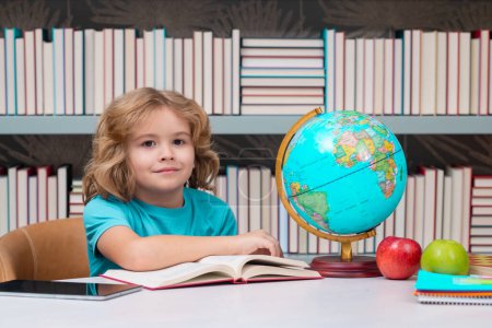 Photo for Kid boy from elementary school with book. Little student, smart nerd pupil ready to study. Concept of education and learning - Royalty Free Image