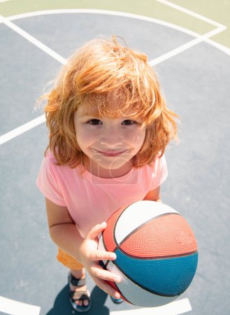 Photo for Head shot of child play basketball. Kids face, little boy portrait - Royalty Free Image