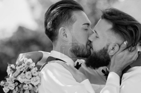 Gay man with partner on wedding day. gay kiss on wedding. marriage gay couple tender kissing. close up portrait of gay kissed