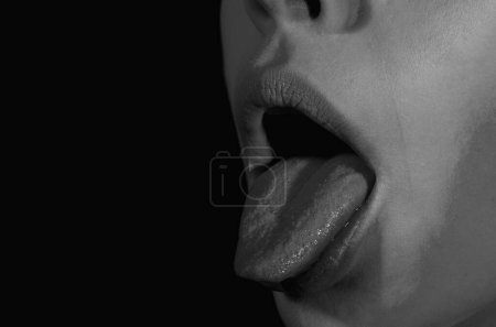 Photo for Tongue and sexy female lips. Sexy sensual womens open mouths. Tongue lick. Close-up Photo Of A Woman Showing Tongue. Closeup photo of funny attractive lady with long tongue. Sexy mouth licking - Royalty Free Image