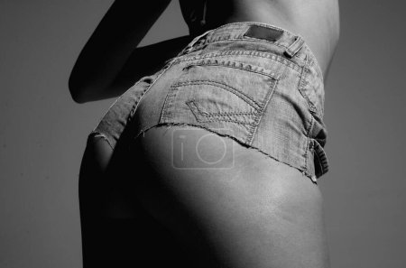 Photo for Female ass in jeans short. Firm butt. Sexy curves girl butt denim short. Beautiful female buttocks. Sexy buttocks. Big sexy ass of beautiful girl. Huge buttocks. Fit slim sexy booty woman back - Royalty Free Image