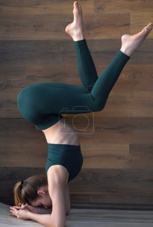 Photo for Yoga woman stretching with pose stretch. Fit fitness athlete girl exercising sports stretches - Royalty Free Image