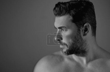Sexy shirtless man close up portrait care of skin, isolated over white background. Charming man with perfect smooth soft skin. Spa therapy. Man, face, beauty and skincare concept