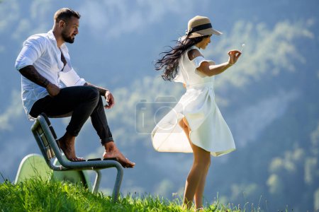 Happy loving couple spending time together on mountains nature. Carefree couples. A sensual couple in love shared tender moments outdoors. Freedom couples. Romantic couple