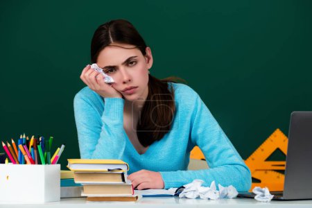 Photo for Sad school girl. Tired bored student having too much. serious student in school. Focused Student concentrating and thinking. Checking homework. Preparing for exam. Studying hard - Royalty Free Image