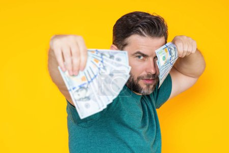 Photo for Rich man holding cash dollar bills on yellow studio. Big luck, banner. Dollar cash money concept. Rejoices to win cash, lucky money. Man hold cash money. Financial luck and success - Royalty Free Image