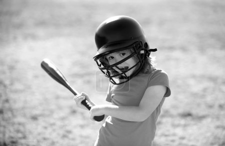 Funny boy kid holding a baseball bat. Pitcher child about to throw in youth baseball