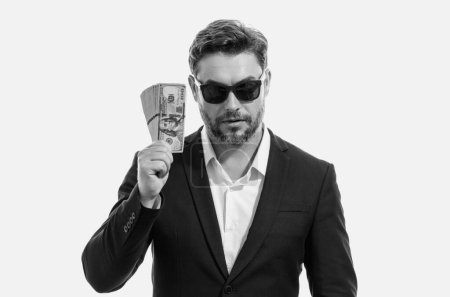 Photo for Man in suit holding cash money in dollar banknotes on isolated white background. Studio portrait of businessman with dollar banknotes. Dollar money. Career wealth business. Cash dollar concept - Royalty Free Image