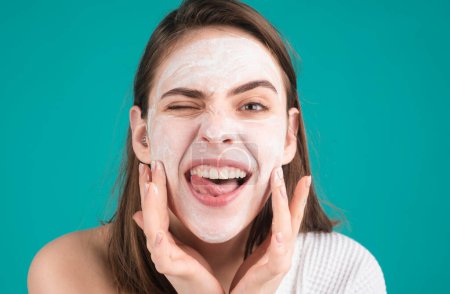 Photo for Woman facial mask with fun, face clay. Funny woman with cosmetic facial procedure, spa skin concept. Skin care beauty treatment. Cosmetology and spa - Royalty Free Image
