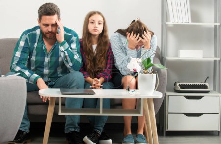 Psychological parents problem. Trouble couple with unhappy child teenager discussing problems in worry family. Conflicts marital couple with kids crisis. Sad father and mother with daughter at home