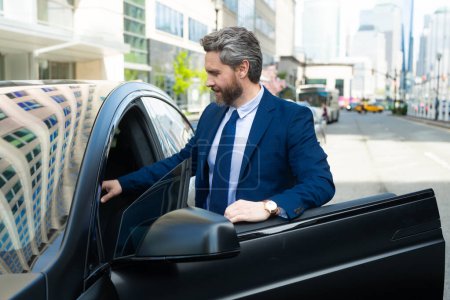 Photo for Portrait of mature business man in car. Happy businessman feeling comfortable sitting in his new car. Success in motion. Car for business. Handsome man in suit sit in car - Royalty Free Image