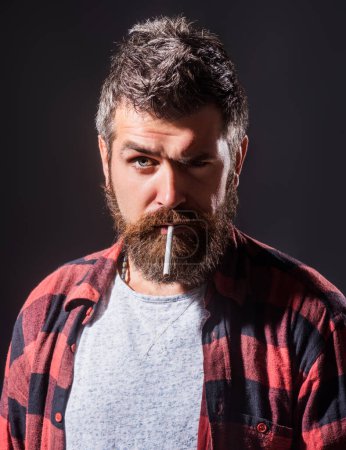 Bearded man smoke cigarette. Beard bristled. Male prickly stubble concept. The prickly bristle. Bearded man without shaving. Man beauty. Take pride in your beard care routine. Beard care