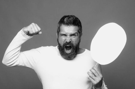 Man with angry expression. Angry hateful guy furious. Angry rage man face. Anger man with furious negative emotion portrait. Aggressive and mad bearded man bad behavior in studio