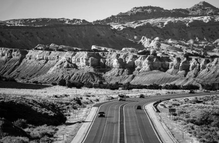 Asphalt highway and hill landscape under the blue sky. Curved Arizona Desert Road